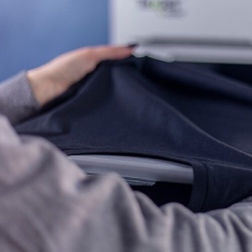 Placing shirt on platen on Texjet Polyprint Echo2 Direct to garment Printer Placing shirt on platen on Texjet Polyprint Echo2 Direct to garment Printer