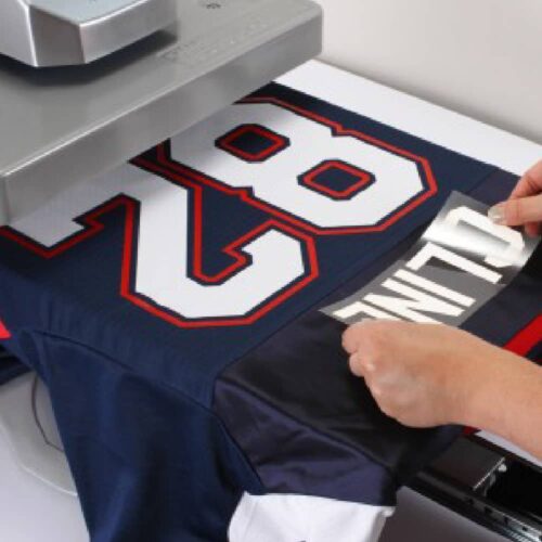 Placing transfer onto sports shirt with Stahls Hotronix Fusion IQ Heatpress Placing transfer onto sports shirt with Stahls Hotronix Fusion IQ Heatpress