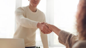 Person shaking somebodys hand Person shaking somebodys hand