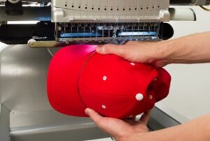 Melco Loading a hooped cap Melco Loading a hooped cap