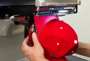 Melco Loading a hooped cap Melco Loading a hooped cap