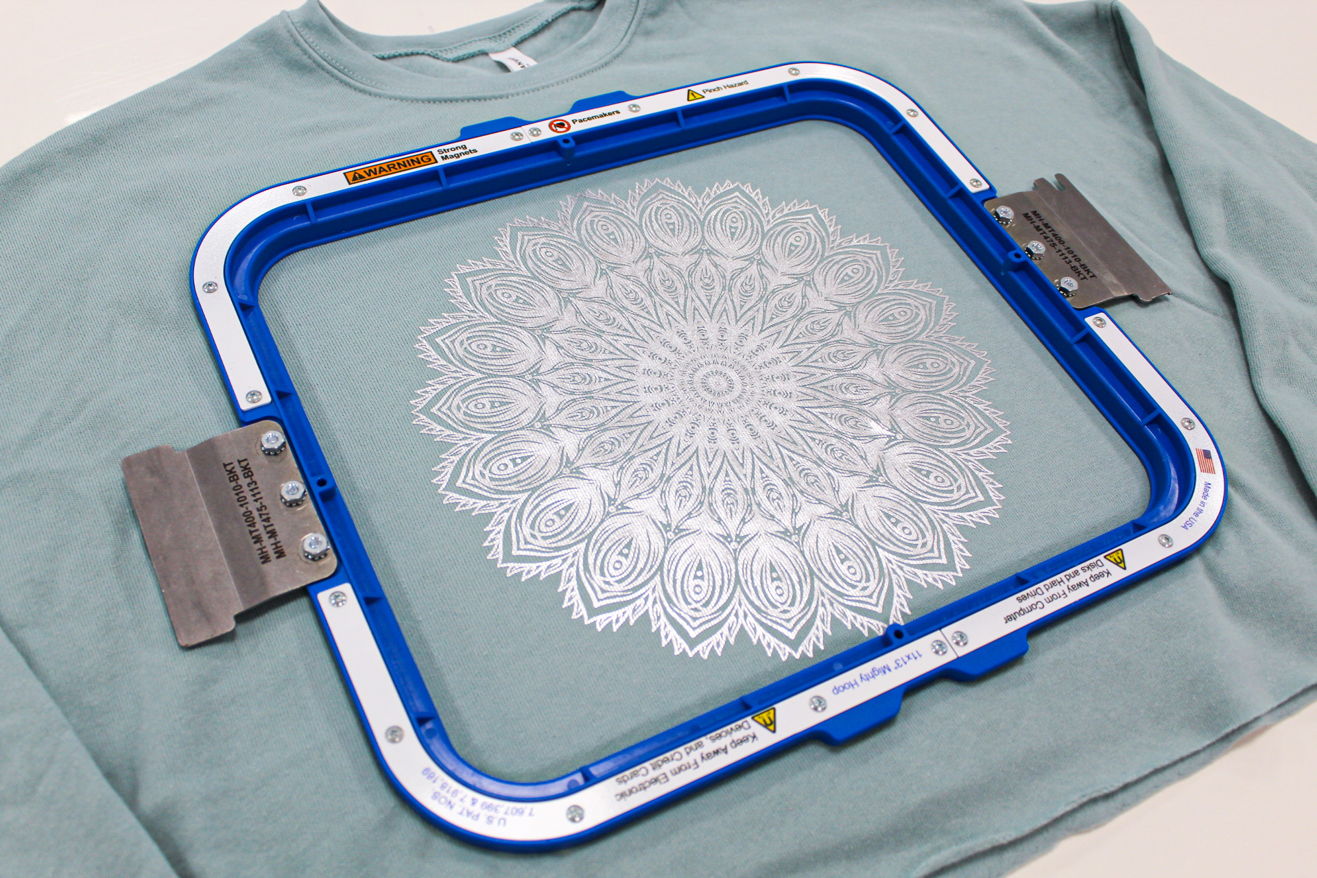 Mixing it up article -Step 6 - Hoop garment ready for machine Mixing it up article -Step 6 - Hoop garment ready for machine